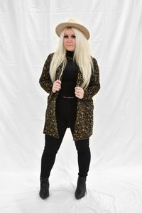 Model wearing a women's leopard print fur blazer coat.