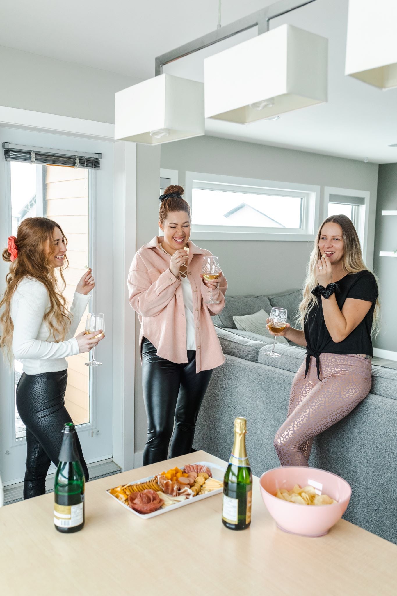 Woman with friends wearing shaping rose gold leopard print cropped leggings.